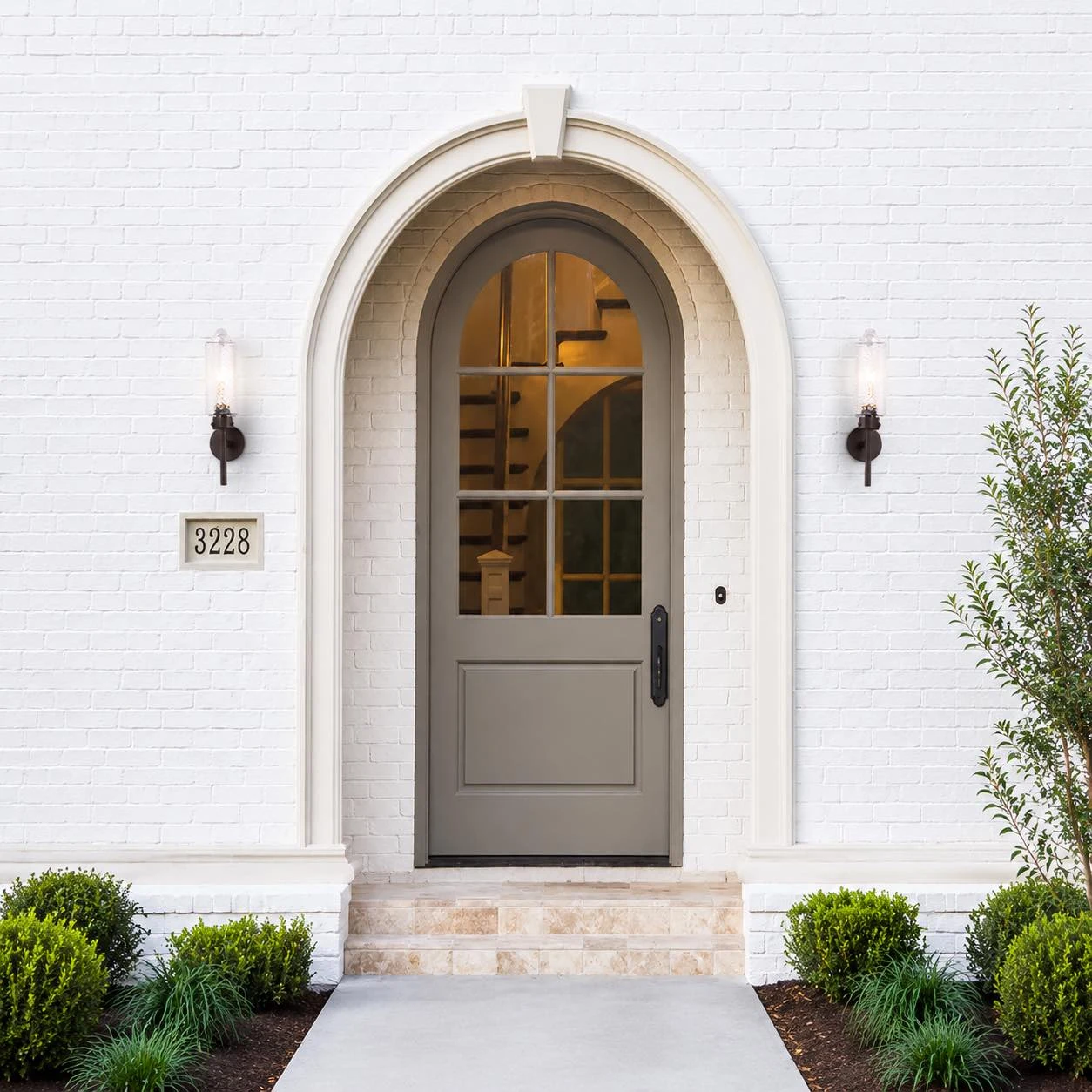 Pair of wall sconces beside an exterior entryway