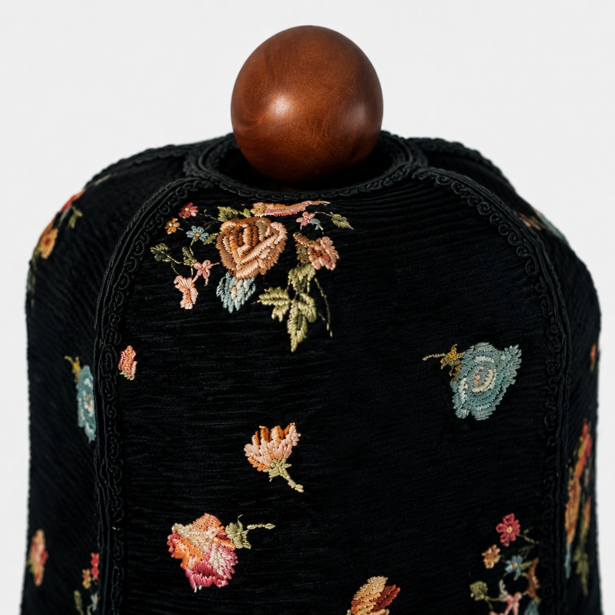 floral fabric and carved wood table lamp
